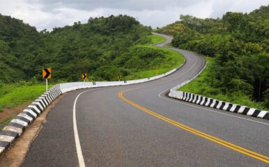 curvy mountain road with guardrails